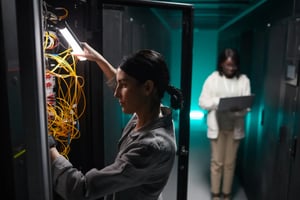 woman-inspecting-server-network-2025-03-05-05-14-27-utc